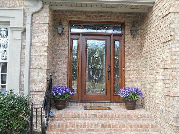 Beautiful front door is just one of the many highlights of this showcase home.