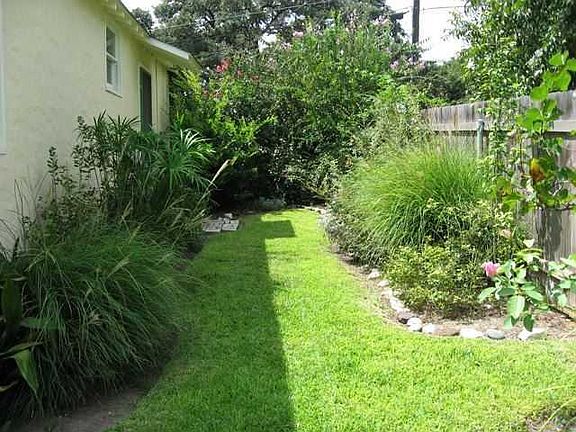 Side entry from living to yard. Nicely landscaped. Owner maintains yard