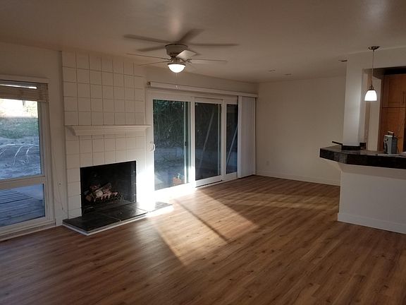 Looking at Dining Room, Fireplace and back yard from Open Living Room