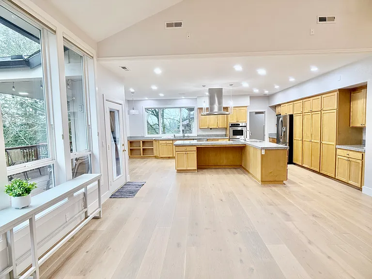 Alternate view of the living space, highlighting its spacious layout and natural flow.