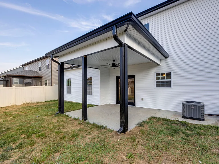 Covered back patio with ceiling fan
