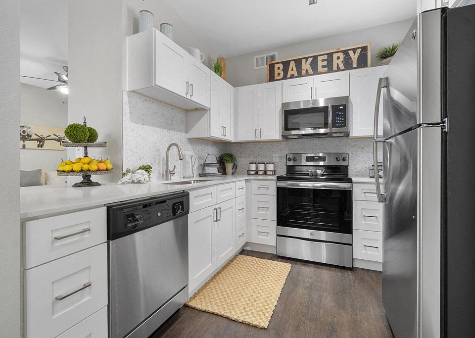 Platinum White Scheme - Newly Renovated Kitchens with GE Stainless Steel Appliances, Custom Cabinetry with Soft-Close Doors and Drawers, and White Marble or Grey Quartz Countertops