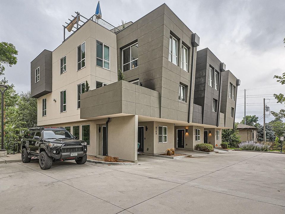 Exterior view of the building with 2 additional parking spots for visitors.