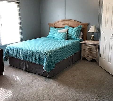lakeside bedroom w/ view