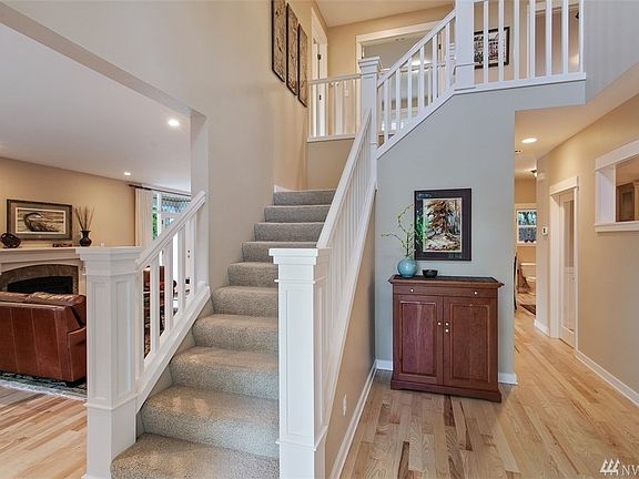 Main floor includes living room, formal dining room, powder bath, laundry room and chef's kitchen with breakfast bar and kitchen dining space!