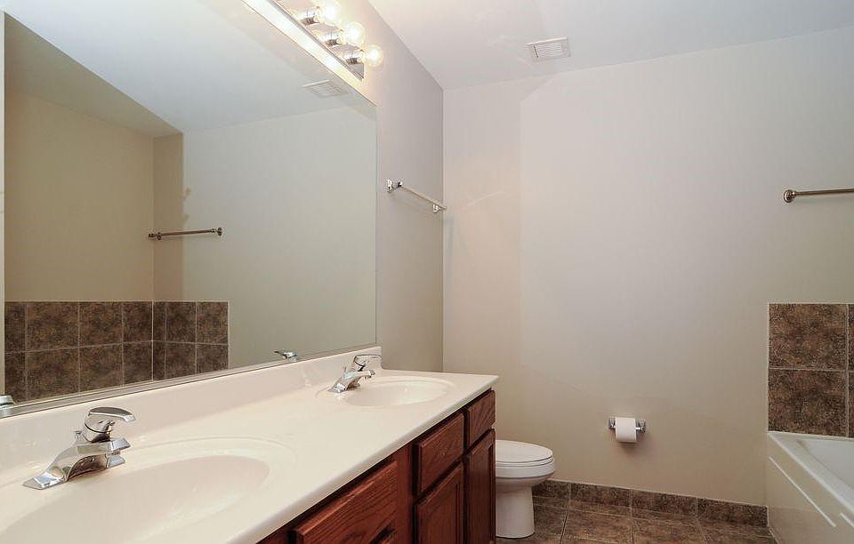 Bathroom with dual sink, large vanity and standing shower + soak tub