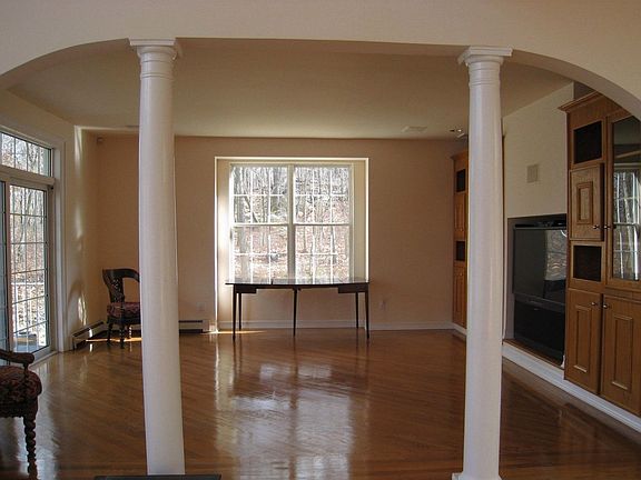 Living Room with Built in entertainment system walks out to stone patio...