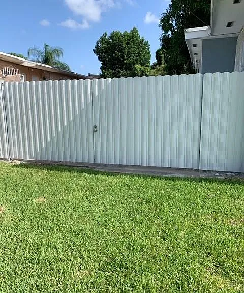 Gate to side yard with lock.