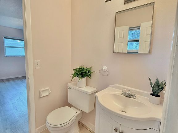 En suite Bathroom with double entry from kitchen and master bath.