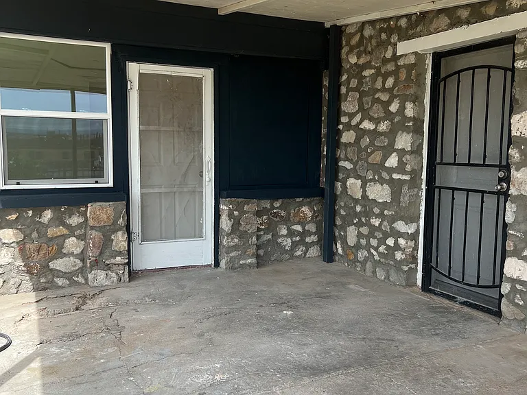 Porch area with entrance to main unit and bedroom 2.