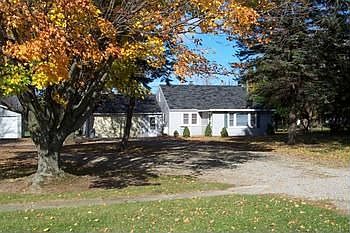 One acre in the village of Port austin! Nice treed lot with a 3 bedroom home, laminate floors, attached garage and an additional large garage style building with high overhead doors, great for boat storage. 