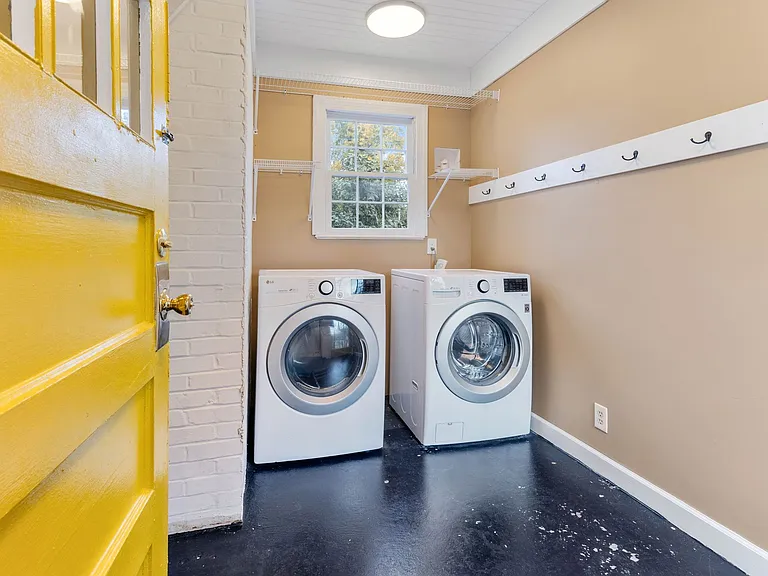 Laundry / Mudroom Off Kitchen Convenient laundry room and mudroom adjacent to kitchen provides practical transition zone and storage space