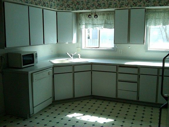 The kitchen is nice and bright with lots of counter space and cabinets.