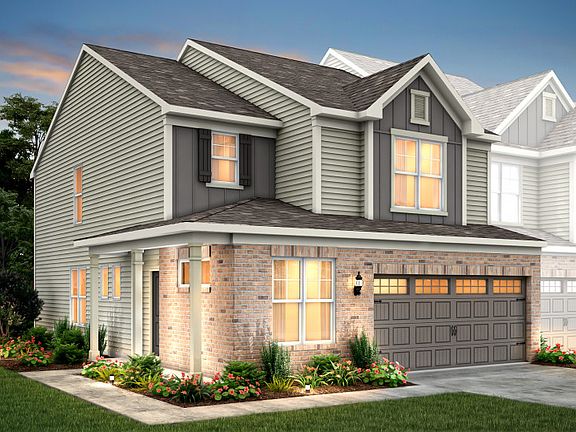 Stetson Exterior 26B features siding, brick, covered side entry front porch and 2 car rear load gara