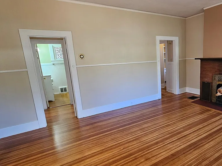 Livingroom with wood burning fireplace.