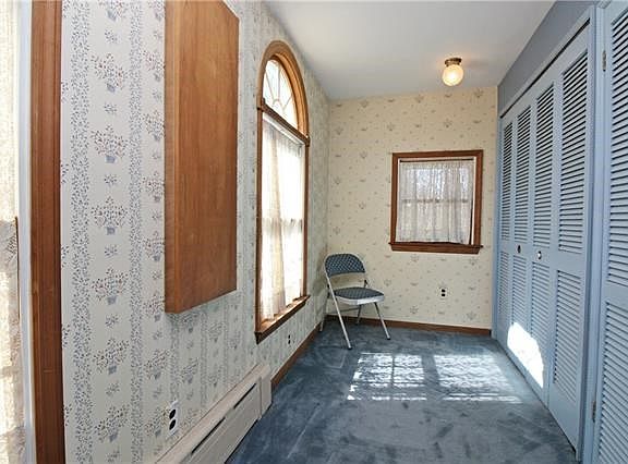 Sitting room or office with generous closet space.