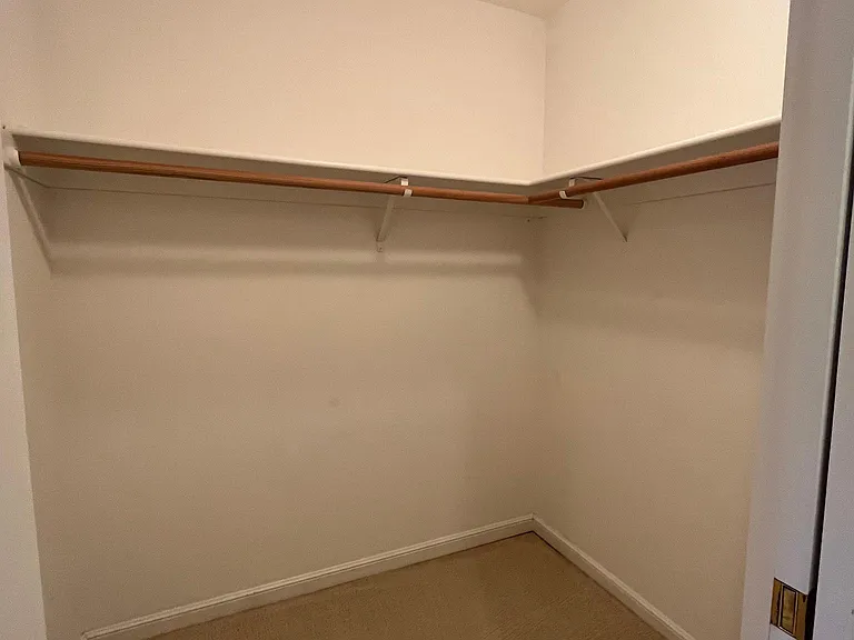 Bedroom #2 has a walk-in closet and comfortable plush carpeting.