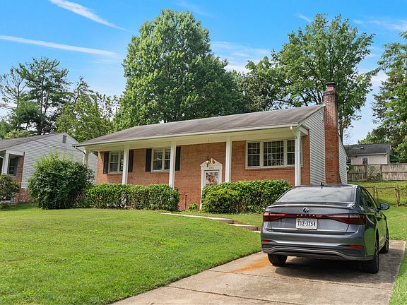 Front of house and driveway to right.