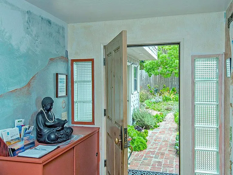 entryway with mural, view into garden