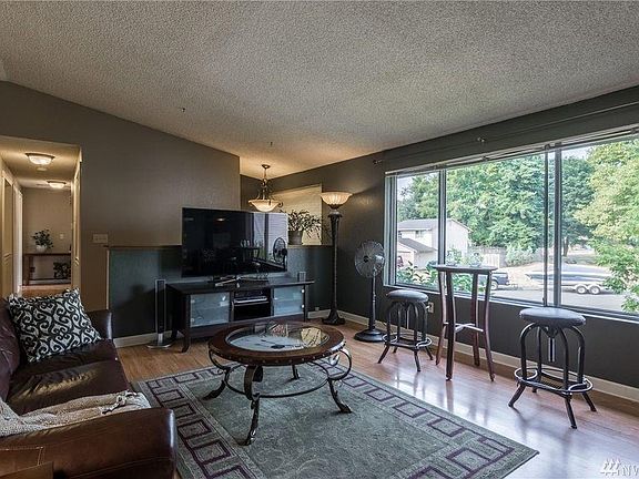 Livingroom Veiw from Diningroom Entry- Large Windows provide natural light.