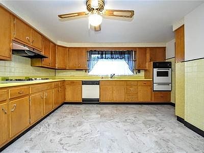 Kitchen with gas range, wall oven, builtin fridge and dishwasher