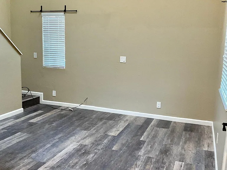 Living room with vaulted ceilings and new laminate floors