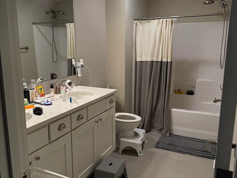 Main bath upstairs with double vanity for kids and tub