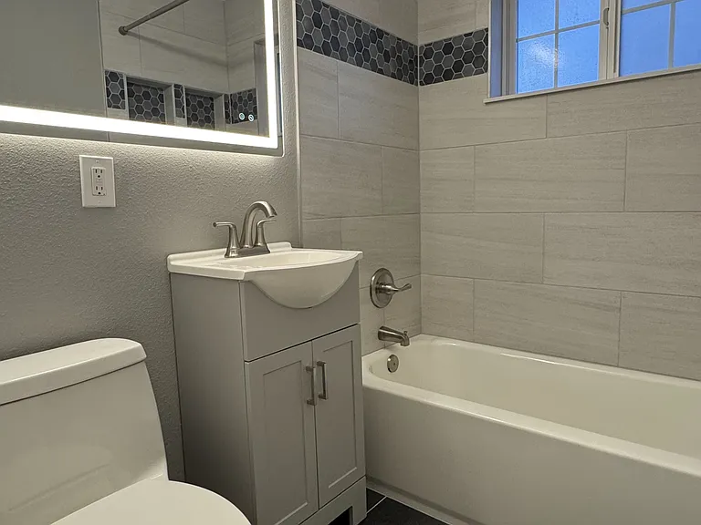 Upstairs - Completely Remodeled Full Bath.