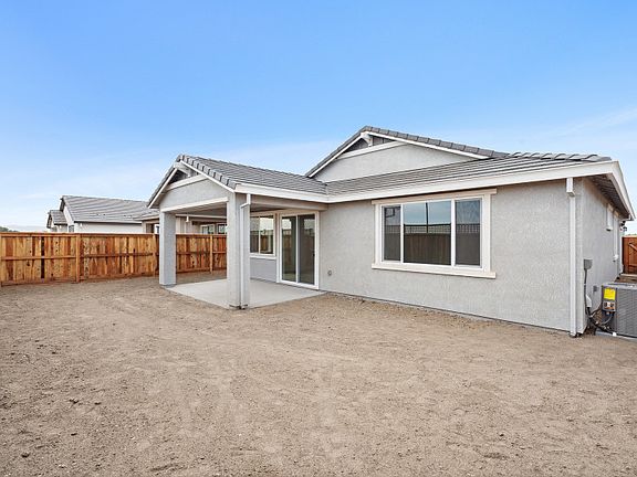Backyard with covered patio area for entertaining