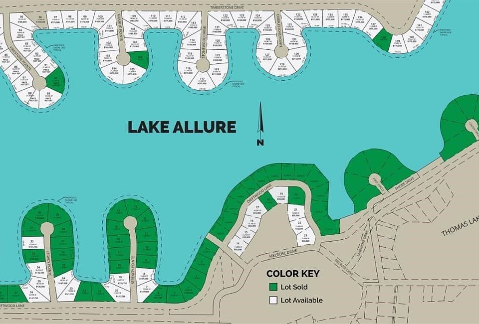 This off-water lot is one of eight still available. Shared beach and all lake privileges.