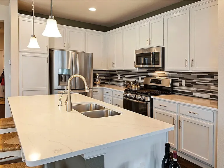 Kitchen with granite countertops and large center island