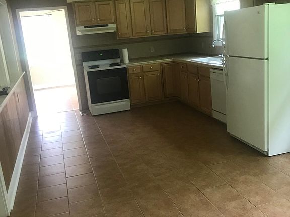 Kitchen with view into den