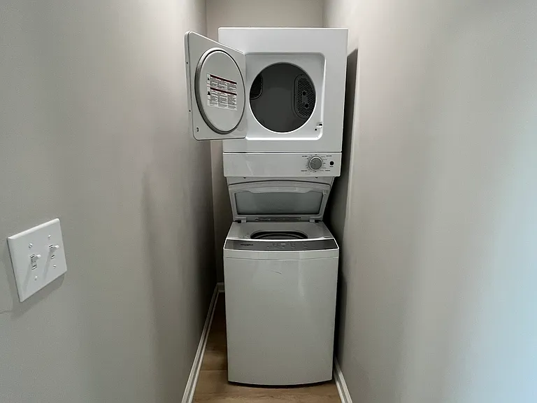 Upper in-unit stacked washer and dryer.