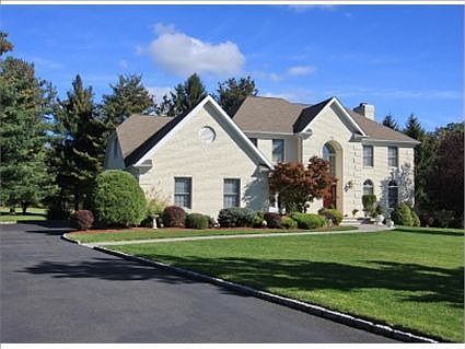 New brick-paver walkway in front and back of home