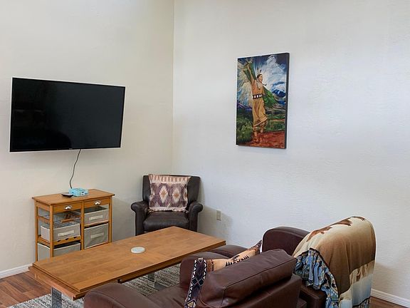 3 comfy chairs, coffee table, large Big screen TV with HDMI cord provided to hook up your devices. High-Speed Internet allows for great streaming.