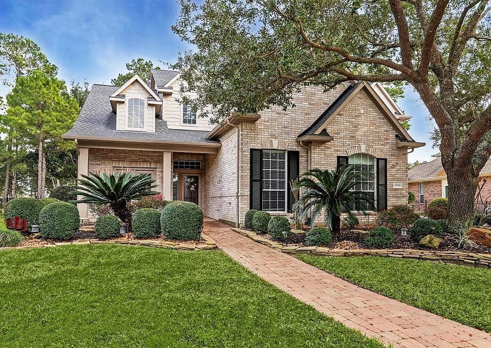 Perfect sized front yard with rick paver walkway and mature trees. Large covered front porch to sip that cool beverage on! Stacked stones enhance the flower beds.