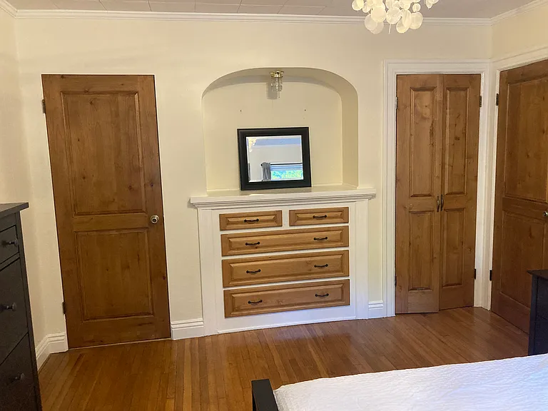 Main Bedroom built in storage, walk-in closet and Powder/Bath
