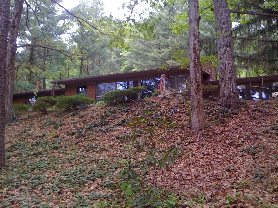 Home is nestled in a quiet, private, wooded lot with great views