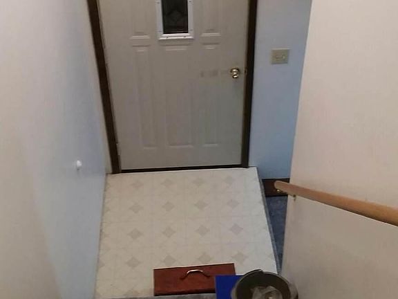 stairway,main front door entrance. view from top of stairs