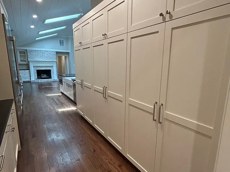 Three huge storage systems next to the kitchen.