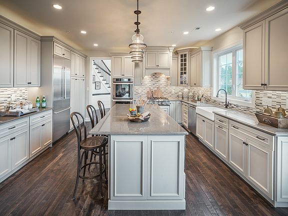 Well-Appointed Kitchen With Large Center Island and Abundance of Cabinet Space