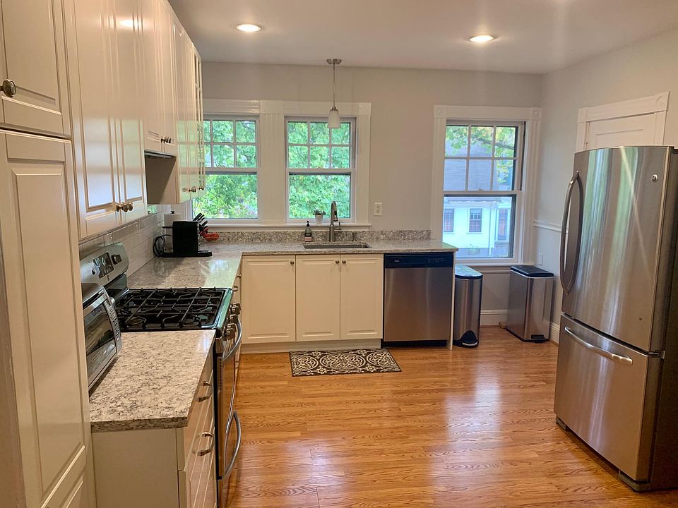 Renovated bright kitchen with quartz countertops, stainless steel appliances, gas stove, dishwasher, disposal and large, walk-in, windowed pantry off kitchen for ample storage.