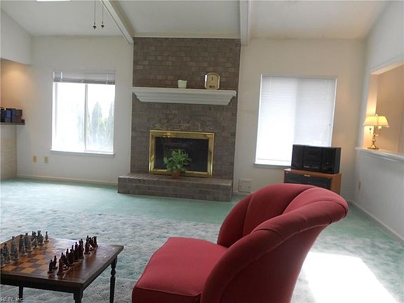 Living Room with Cathedral Ceiling, Ceiling Fran, Gas Fireplace, Wet Bar, opens to large Kitchen.