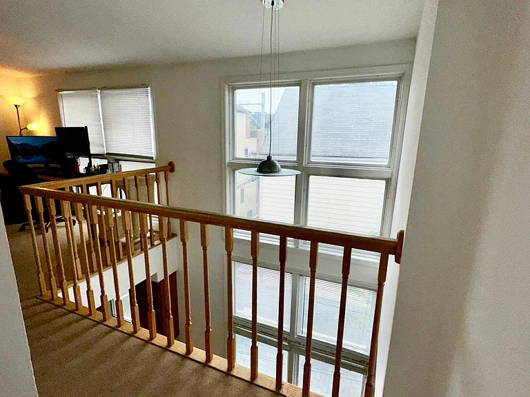 LOFT OVERLOOKS LOWER LEVEL
