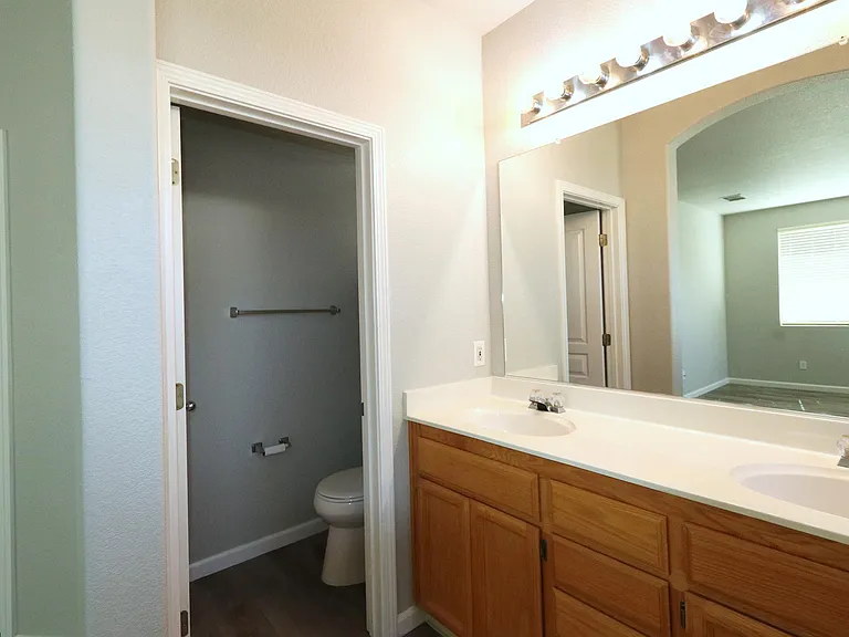 Master Bathroom with Double Sinks and Vanity Lights