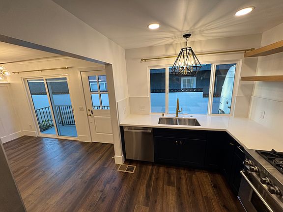 Open flow kitchen turns into galley style cabinets