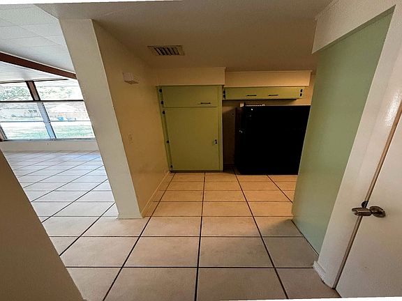 Kitchen from hallway and the living area to the left