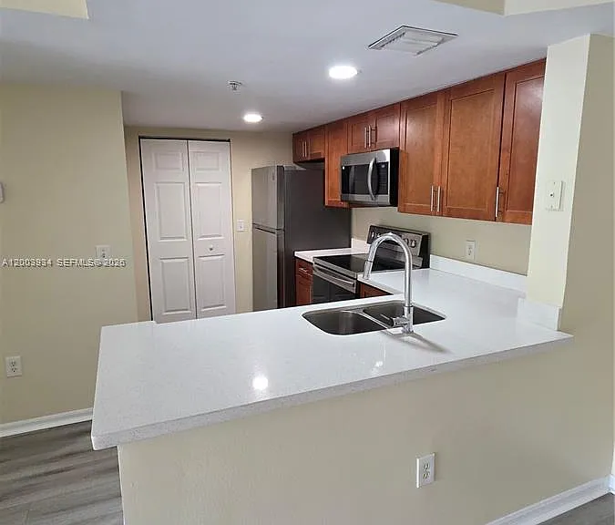 5051 Wiles Rd #201 — Photo 1