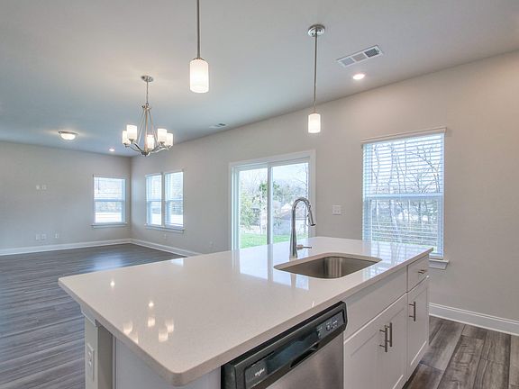 The stunning kitchen island overlooks the open-concept living space.