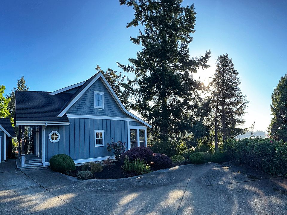 Side view of home, garage and parking area.